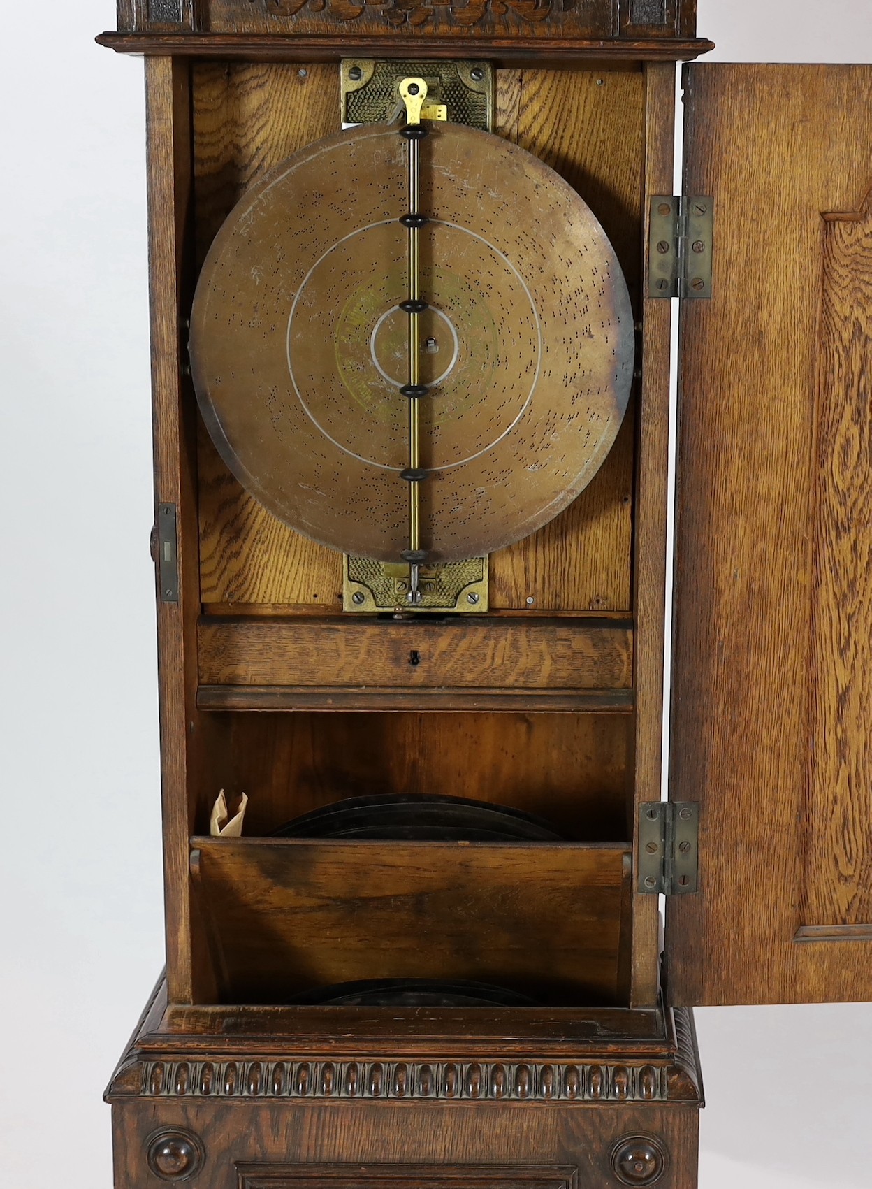 A Symphonion oak musical longcase hall clock, c.1895, playing 13.5in. discs, width 58cm depth 37cm height 235cm